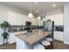 Spacious kitchen with stainless steel appliances, island, and plenty of cabinet space at 31311 N 138Th Ave, Peoria, AZ 85383