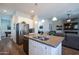 Modern kitchen featuring stainless steel appliances, granite counters, and an island with a sink at 31311 N 138Th Ave, Peoria, AZ 85383