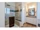 Tiled shower with glass door, built-in bench, and decorative accent at 31311 N 138Th Ave, Peoria, AZ 85383