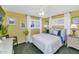 Bright bedroom with a queen bed, white linens, shuttered windows, and neutral-toned walls at 3351 N 6Th Ave, Phoenix, AZ 85013