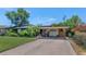 Traditional single-story home with lush landscaping, a covered carport and a well-kept lawn at 3351 N 6Th Ave, Phoenix, AZ 85013