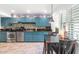 Cozy kitchen featuring vintage blue cabinets, stainless steel appliances, and tile flooring at 3351 N 6Th Ave, Phoenix, AZ 85013