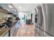 Modern kitchen featuring stainless steel appliances, granite countertops, and tile flooring at 3351 N 6Th Ave, Phoenix, AZ 85013