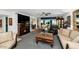 Open living space with a cozy fireplace, refined furniture and a view of dining area at 3351 N 6Th Ave, Phoenix, AZ 85013