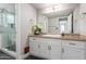 Bathroom with elegant modern vanity, large mirror and mosaic tile floors at 3500 N Hayden Rd # 801, Scottsdale, AZ 85251