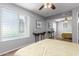 Bedroom with wood-look floors, ceiling fan, big window, and mirrored sliding-door closet at 3500 N Hayden Rd # 801, Scottsdale, AZ 85251
