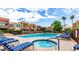 Relaxing community pool and spa with lounge chairs and tropical landscaping creates a resort-style atmosphere at 3500 N Hayden Rd # 801, Scottsdale, AZ 85251