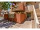 Inviting condo exterior featuring a private balcony and a stairway, and desert landscaping at 3500 N Hayden Rd # 801, Scottsdale, AZ 85251
