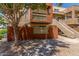 Well-maintained condo exterior with a private patio, a stairway, and desert landscaping at 3500 N Hayden Rd # 801, Scottsdale, AZ 85251