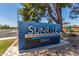 Attractive 'Sunrise Condominiums' sign with clear numbering and professional landscaping enhancing curb appeal at 3500 N Hayden Rd # 801, Scottsdale, AZ 85251