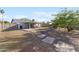 Large, fenced backyard with a covered patio and low maintenance landscaping, perfect for entertaining at 3508 E Gelding Dr, Phoenix, AZ 85032