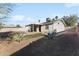 This home's backyard features a covered patio, low maintenance landscaping, and a fenced yard at 3508 E Gelding Dr, Phoenix, AZ 85032