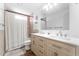 Bright bathroom with a double vanity and a shower-tub combo at 3508 E Gelding Dr, Phoenix, AZ 85032