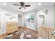 Bright Bedroom featuring a wooden crib, dresser, and a view of the yard at 3508 E Gelding Dr, Phoenix, AZ 85032