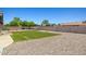 Large backyard featuring desert landscaping, artificial turf, and a private hot tub at 3747 W Aire Libre Ave, Phoenix, AZ 85053