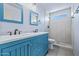 Bright bathroom features a double sink vanity with a walk-in shower and modern fixtures at 3747 W Aire Libre Ave, Phoenix, AZ 85053