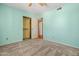 A bedroom features carpet, and an open closet at 3747 W Aire Libre Ave, Phoenix, AZ 85053