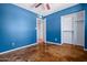 A bedroom featuring a spacious closet and a window providing natural light at 3747 W Aire Libre Ave, Phoenix, AZ 85053