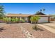Single-story home with desert landscaping and a two-car garage at 3747 W Aire Libre Ave, Phoenix, AZ 85053