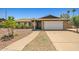 Single-story brick home with a two-car garage and desert landscaping at 3747 W Aire Libre Ave, Phoenix, AZ 85053