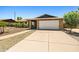 Single-story brick home with a well-maintained two-car garage and desert landscaping at 3747 W Aire Libre Ave, Phoenix, AZ 85053