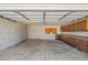 Spacious garage with built-in cabinets, offering ample storage and workspace at 3747 W Aire Libre Ave, Phoenix, AZ 85053