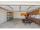 Well-lit garage with built-in cabinets, storage shelves, and ample space for vehicles at 3747 W Aire Libre Ave, Phoenix, AZ 85053