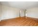 Spacious living room features wood floors with easy access to other areas in the home at 3747 W Aire Libre Ave, Phoenix, AZ 85053