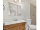 Bright bathroom with a wood vanity, toilet, and shower with tiled walls at 3821 N 28Th St, Phoenix, AZ 85016