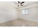 Neutral bedroom featuring a ceiling fan, window, and tiled floor at 3821 N 28Th St, Phoenix, AZ 85016