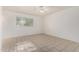 Neutral bedroom featuring a ceiling fan, window, and tiled floor at 3821 N 28Th St, Phoenix, AZ 85016