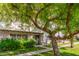 Charming condo featuring mature shade trees, verdant lawns, and a welcoming walkway at 3821 N 28Th St, Phoenix, AZ 85016