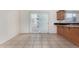 Sunlit kitchen area with tiled floors, wood cabinets, and outdoor access at 3821 N 28Th St, Phoenix, AZ 85016