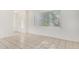 Clean living room featuring white walls, tile floors, bright windows, and ample natural light at 3821 N 28Th St, Phoenix, AZ 85016