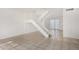 Bright and airy living room with tiled floors and a staircase to the upper level at 3821 N 28Th St, Phoenix, AZ 85016