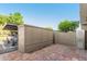 Exterior shot of the back patio featuring a vehicle, storage unit, and an outdoor brick surface at 3821 N 28Th St, Phoenix, AZ 85016