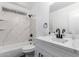 Modern bathroom featuring shower over tub, marble-style surfaces, and vanity at 3829 W Camino Del Rio --, Glendale, AZ 85310