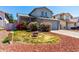 Charming two-story home featuring delightful curb appeal with bright pink and red bushes at 3829 W Camino Del Rio --, Glendale, AZ 85310