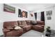 This living room has a large sectional sofa and multiple wall decorations at 3829 W Camino Del Rio --, Glendale, AZ 85310