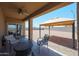 Covered patio with seating overlooking the backyard and gazebo at 4088 N 309Th Cir, Buckeye, AZ 85396