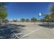 Outdoor basketball court with well-maintained surface, hoops, and surrounding landscaping at 4088 N 309Th Cir, Buckeye, AZ 85396