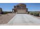 Well-maintained two-story home with a spacious driveway and desert-friendly landscaping for easy upkeep at 4088 N 309Th Cir, Buckeye, AZ 85396
