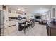 Open kitchen with island seating flows to the living area, offering an ideal gathering space at 4088 N 309Th Cir, Buckeye, AZ 85396