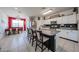 Bright kitchen with granite countertops, stainless steel appliances, and island seating at 4088 N 309Th Cir, Buckeye, AZ 85396
