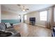 Bright and airy living room featuring hardwood floors and a ceiling fan at 4088 N 309Th Cir, Buckeye, AZ 85396