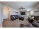 Spacious living room with a ceiling fan and an accent wall, providing a cozy and inviting space at 4088 N 309Th Cir, Buckeye, AZ 85396