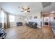 Cozy living room featuring hardwood floors, neutral walls, and ceiling fan at 4088 N 309Th Cir, Buckeye, AZ 85396