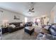 Open-concept living room flows into the kitchen, perfect for entertaining and Gathering gatherings at 4088 N 309Th Cir, Buckeye, AZ 85396