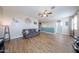 Open-concept living room with modern decor, stylish flooring, and ample natural light, creating a welcoming atmosphere at 4088 N 309Th Cir, Buckeye, AZ 85396
