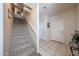 Carpeted staircase leads to the upper level, complemented by neutral tones and ample lighting at 4088 N 309Th Cir, Buckeye, AZ 85396